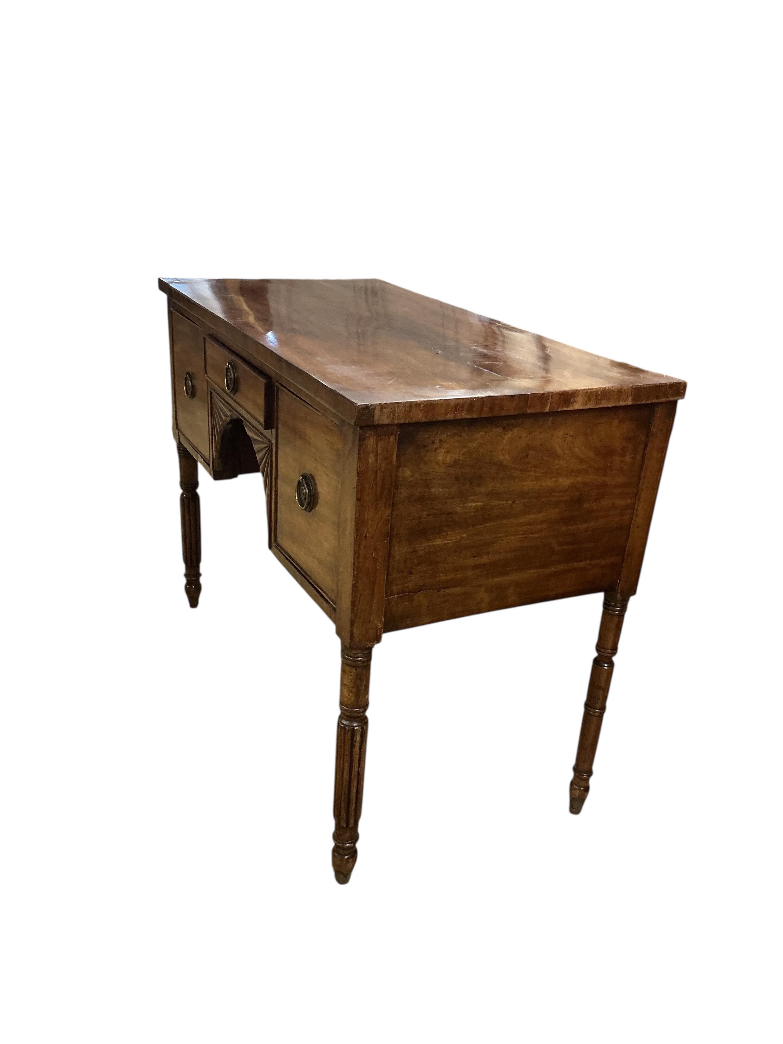 A Regency mahogany kneehole dressing table, width 94cm, depth 47cm, height 72cm